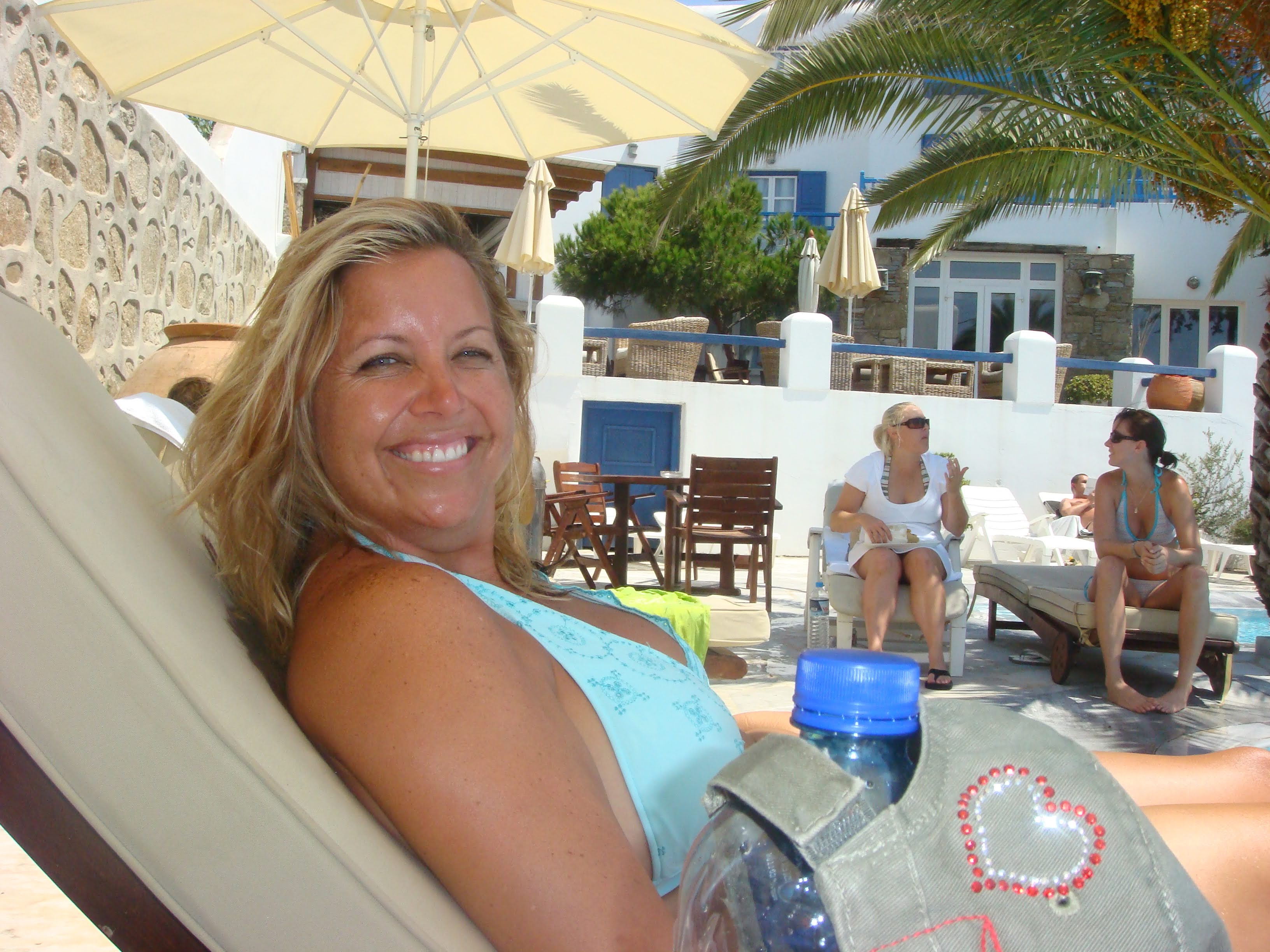 Mary lounging at Greek pool